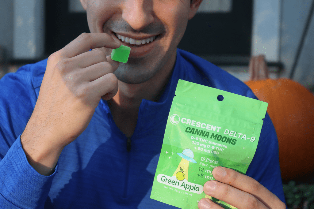 Man eating Canna Moons THC Gummies