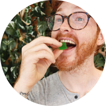 Man eating THC gummy