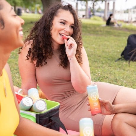 Woman eating Delta-9 gummies