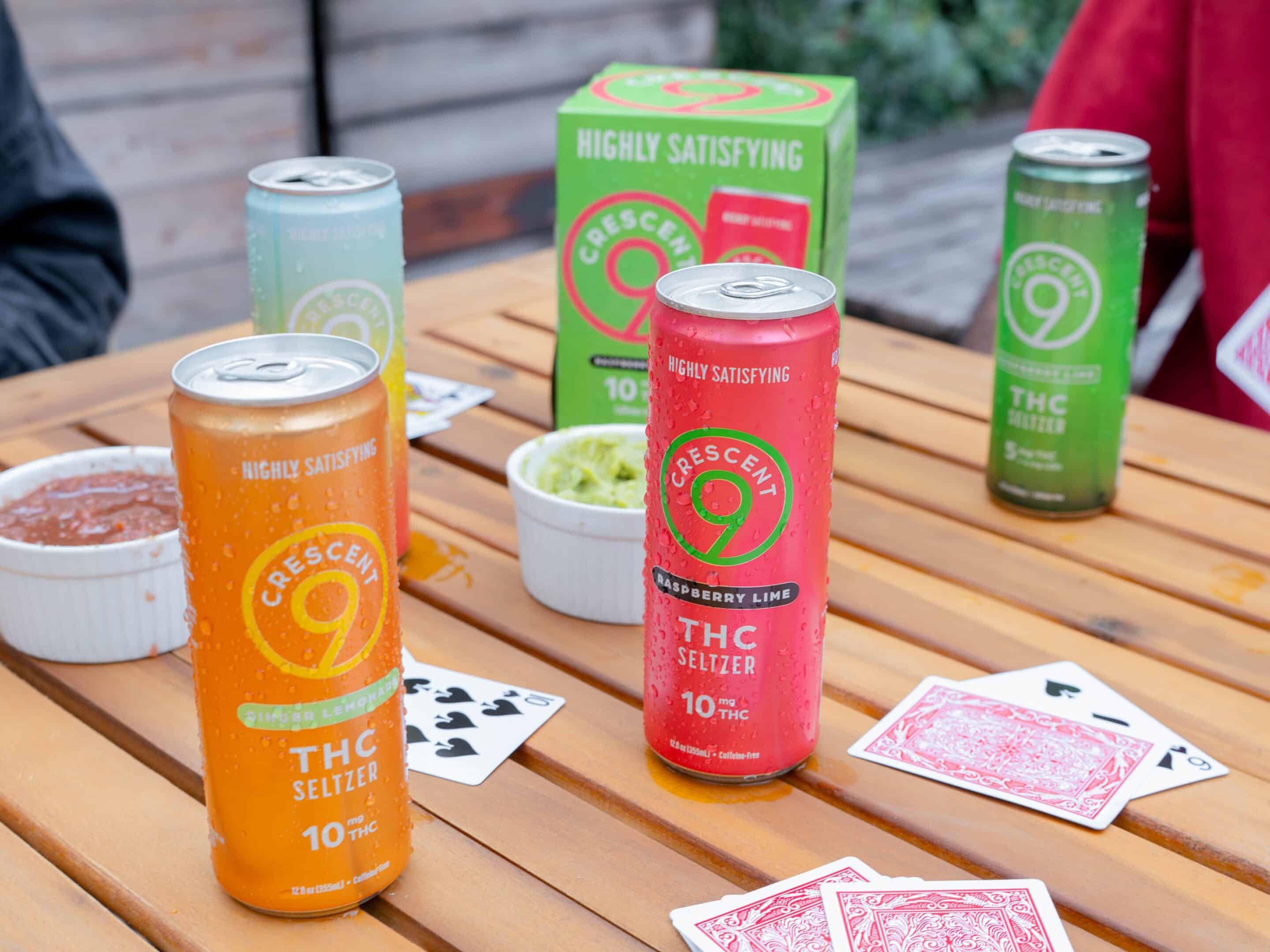 Cans with multiple THC dosages on a table