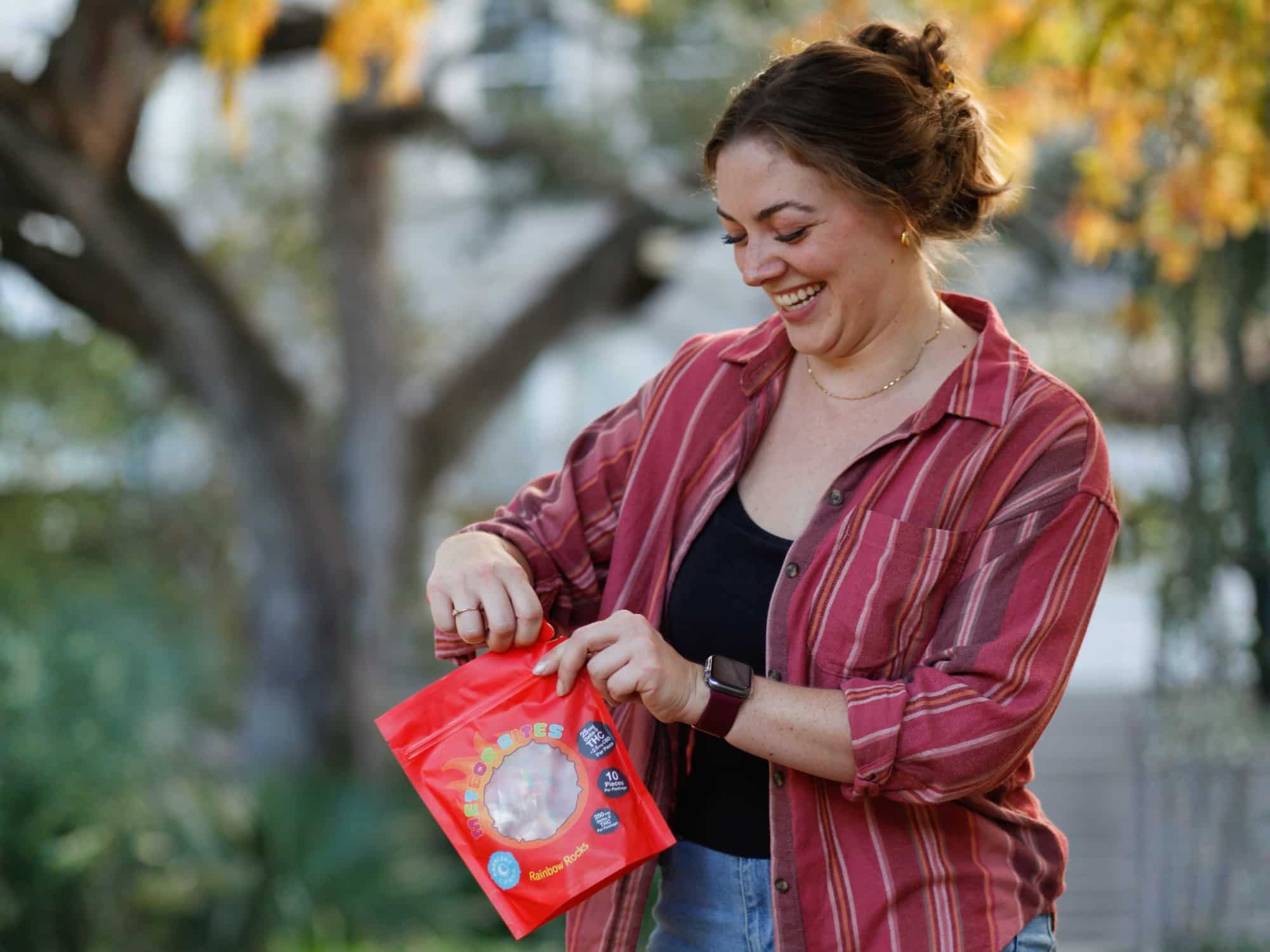 A woman opening a bag of THC cereal bars